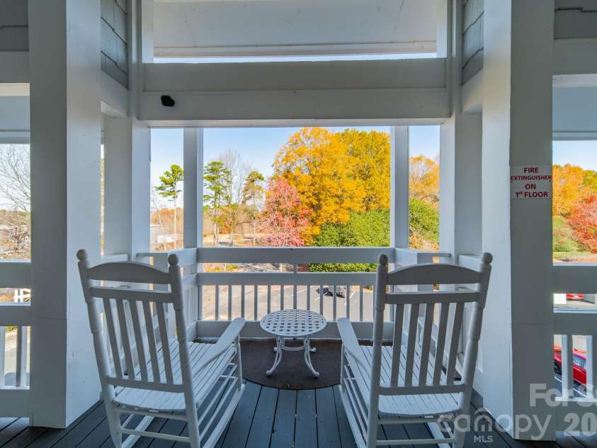 17919 Kings Point Drive, Cornelius, NC 28031.  MLS# CAR4320455, YatesRealty ID 11229. Pretty, treed view from the front porch entry area...