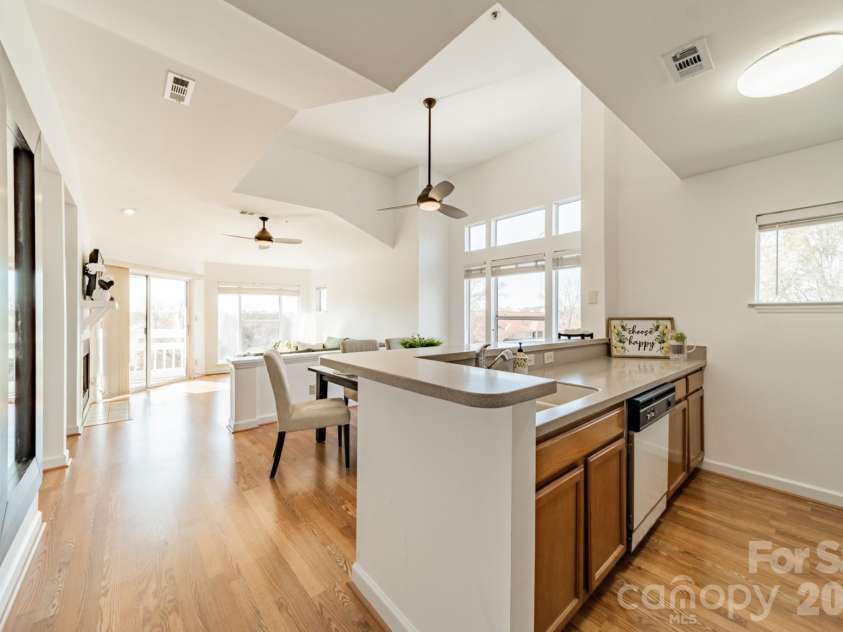 17919 Kings Point Drive, Cornelius, NC 28031.  MLS# CAR4320455, YatesRealty ID 11229. You will LOVE the high ceilings, the OODLES of windows and the fresh, happy natural light!  As a bonus, the popcorn ceilings have already been removed, and it now has smooth, painted ceilings.