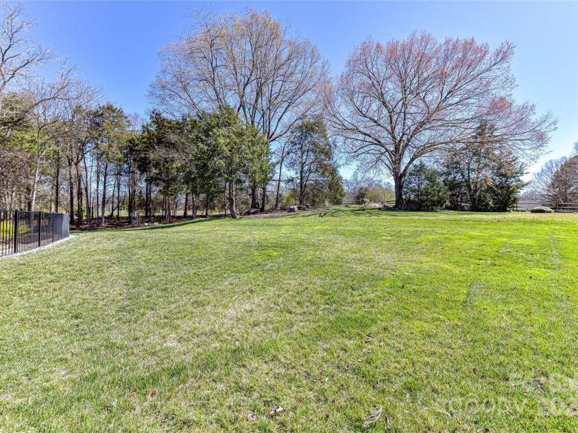7295 Three Sisters Lane, Concord, NC 28027.  MLS# CAR4239485, YatesRealty ID 11233. Back Yard with so much space works great for activities!