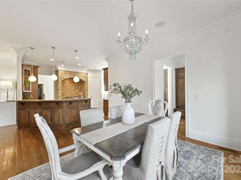 7295 Three Sisters Lane, Concord, NC 28027.  MLS# CAR4239485, YatesRealty ID 11233. Breakfast/Dining Area with custom chandelier!