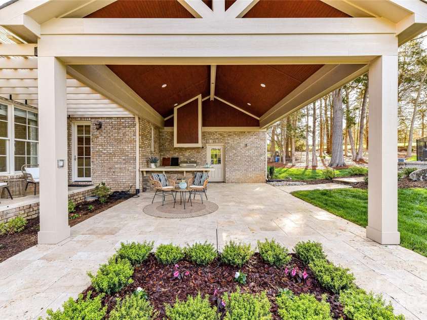 7295 Three Sisters Lane, Concord, NC 28027.  MLS# CAR4239485, YatesRealty ID 11233. Covered Patio Area perfect for relaxing & enjoying your fabulous property & equally perfect for entertaining!