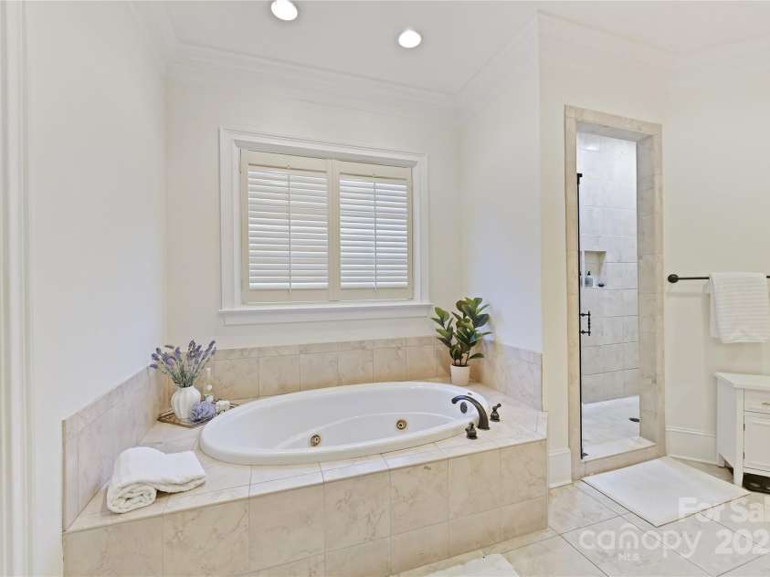 7295 Three Sisters Lane, Concord, NC 28027.  MLS# CAR4239485, YatesRealty ID 11233. Primary Bath features dual vanity, whirlpool tub, tile walk in shower, separate water closet & tile floors!