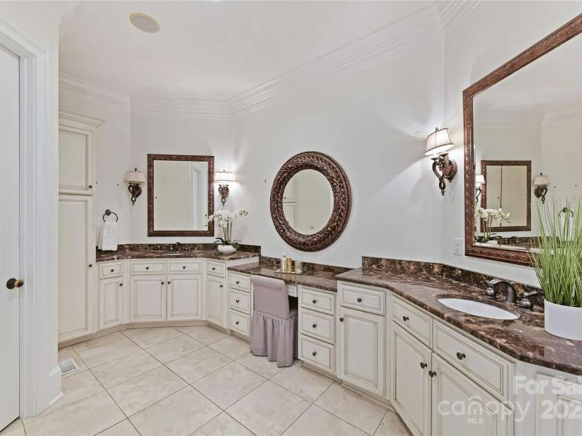 7295 Three Sisters Lane, Concord, NC 28027.  MLS# CAR4239485, YatesRealty ID 11233. Primary Bath features dual vanity, whirlpool tub, tile walk in shower, separate water closet & tile floors!