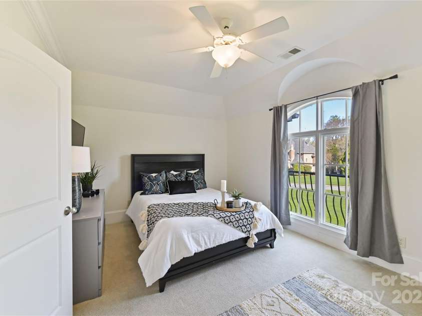 7295 Three Sisters Lane, Concord, NC 28027.  MLS# CAR4239485, YatesRealty ID 11233. Spacious Bedroom 4 on upper level with crown molding!