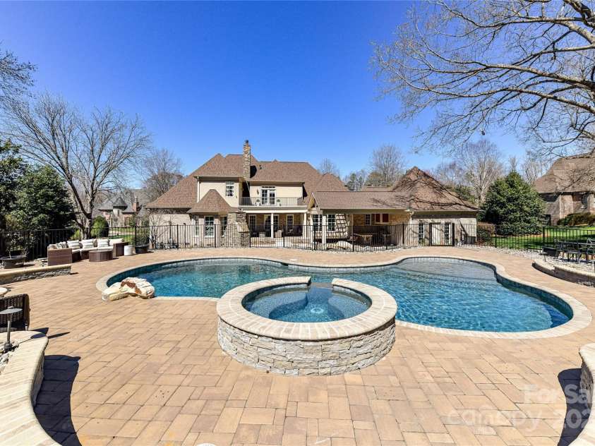 7295 Three Sisters Lane, Concord, NC 28027.  MLS# CAR4239485, YatesRealty ID 11233. Spectacular Pool/Spa (salt water) with plenty of decking for seating for family/friends!