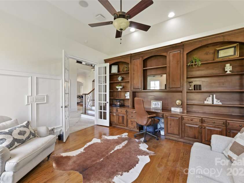 7295 Three Sisters Lane, Concord, NC 28027.  MLS# CAR4239485, YatesRealty ID 11233. Study/Office with tray ceiling, custom built ins & custom moldings!