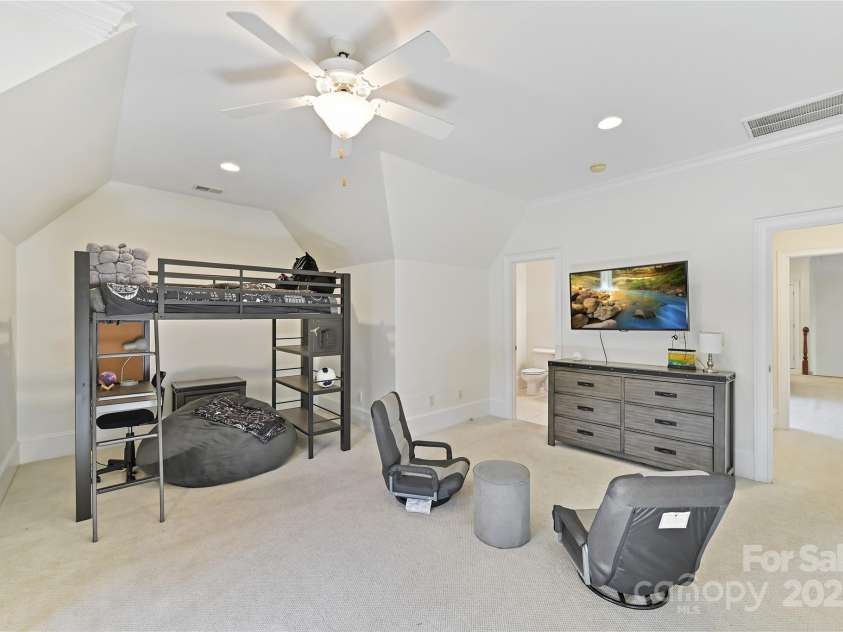 7295 Three Sisters Lane, Concord, NC 28027.  MLS# CAR4239485, YatesRealty ID 11233. Vaulted Bedroom 5 on upper level with ceiling fan/light & recessed lights!