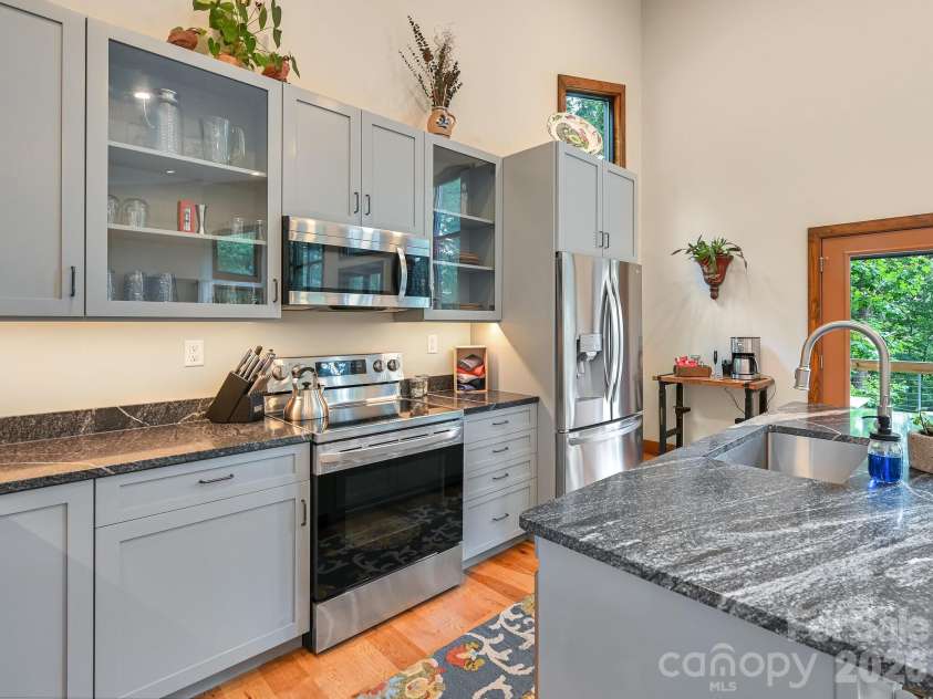 43 Tinkling Springs Lane, Fairview, NC 28730.  MLS# CAR4361581, YatesRealty ID 11237. Custom Built Cabinets in Kitchen