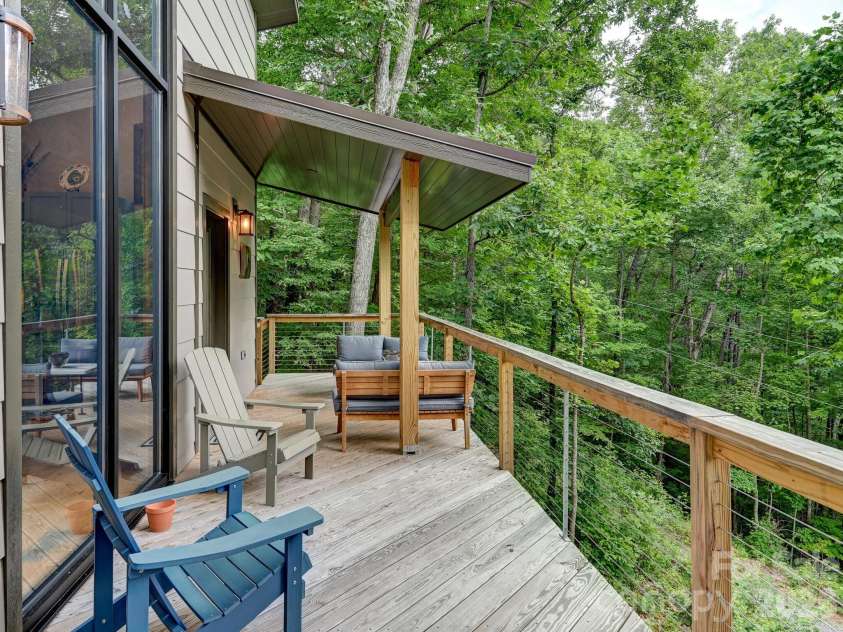43 Tinkling Springs Lane, Fairview, NC 28730.  MLS# CAR4361581, YatesRealty ID 11237. Expansive Deck with Cable Railing
