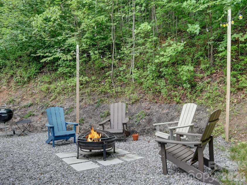 43 Tinkling Springs Lane, Fairview, NC 28730.  MLS# CAR4361581, YatesRealty ID 11237. Fire-pit Entertaining Area