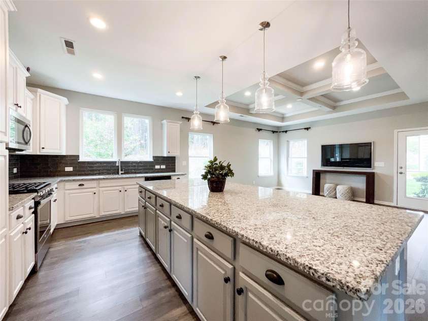 21228 Sanctuary Drive, Lancaster, SC 29720.  MLS# CAR4364757, YatesRealty ID 11249. Kitchen island with storage