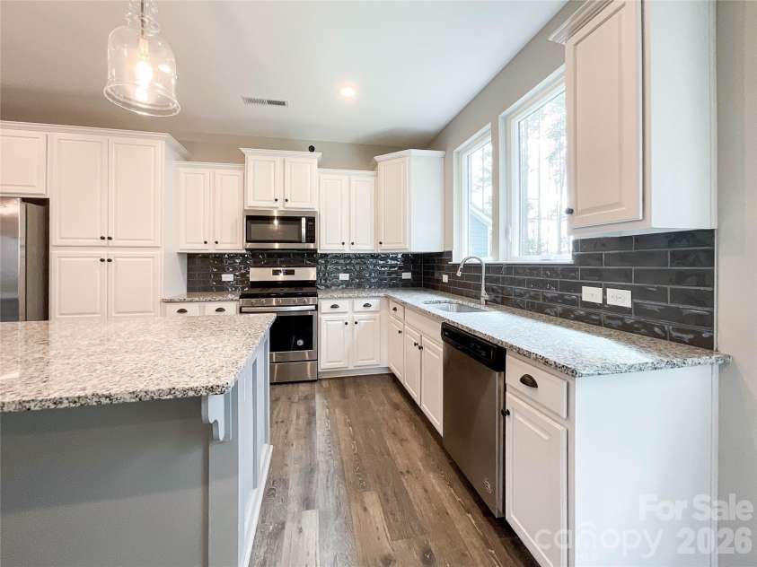 21228 Sanctuary Drive, Lancaster, SC 29720.  MLS# CAR4364757, YatesRealty ID 11249. Kitchen layout with updated tile backsplash