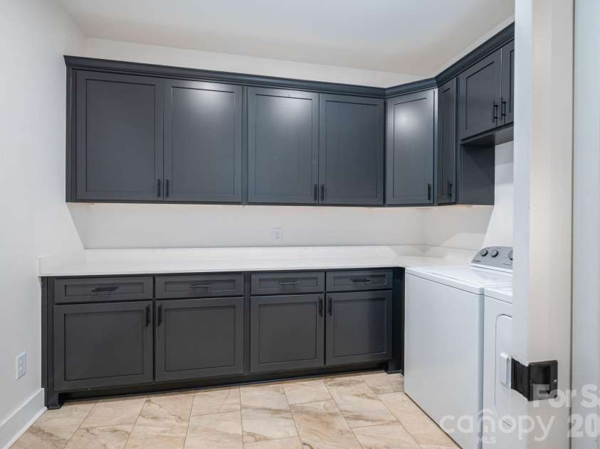 6335 Forney Hill Road, Denver, NC 28037.  MLS# CAR4346554, YatesRealty ID 11253. Large laundry room.  Tile floors