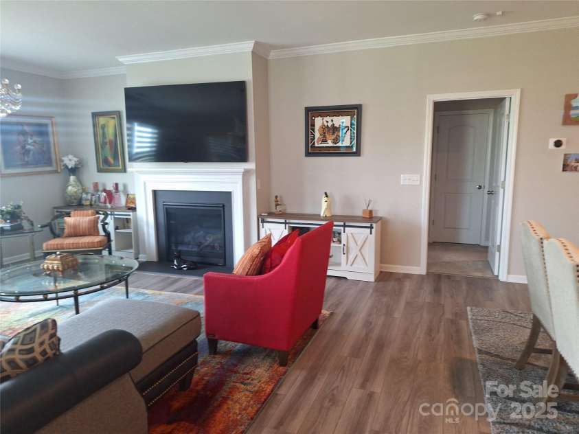 1202 Calder Drive, Indian Trail, NC 28079.  MLS# CAR4250682, YatesRealty ID 11254. Great Room with Fireplace & Mantel. Entrance to Primary Suite