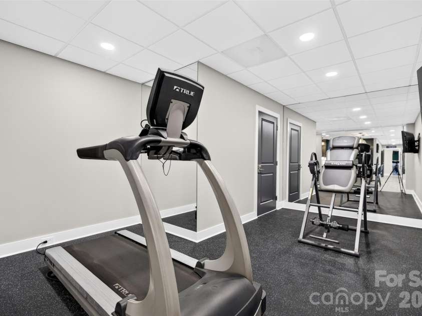7144 Lynbrook Creek Road, Denver, NC 28037.  MLS# CAR4410382, YatesRealty ID 11263. GLassed in workout room  Lower Level