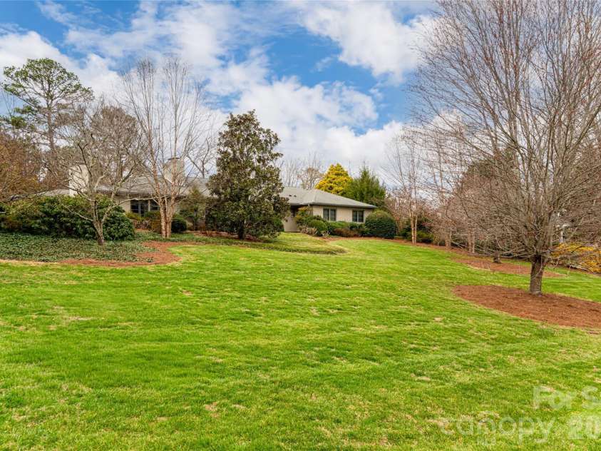 21 Pine Tree Circle, Asheville, NC 28804.  MLS# CAR4344611, YatesRealty ID 11264. Park-like setting