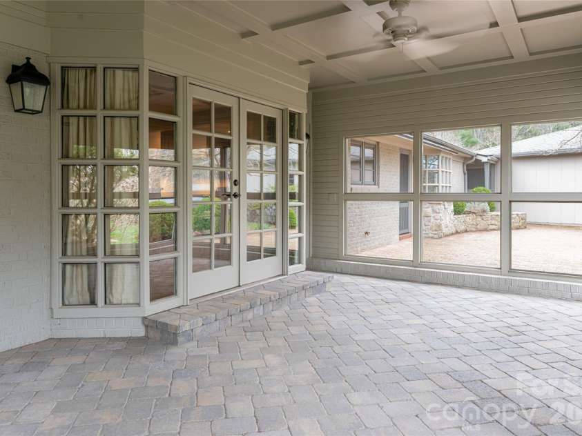 21 Pine Tree Circle, Asheville, NC 28804.  MLS# CAR4344611, YatesRealty ID 11264. Screened porch