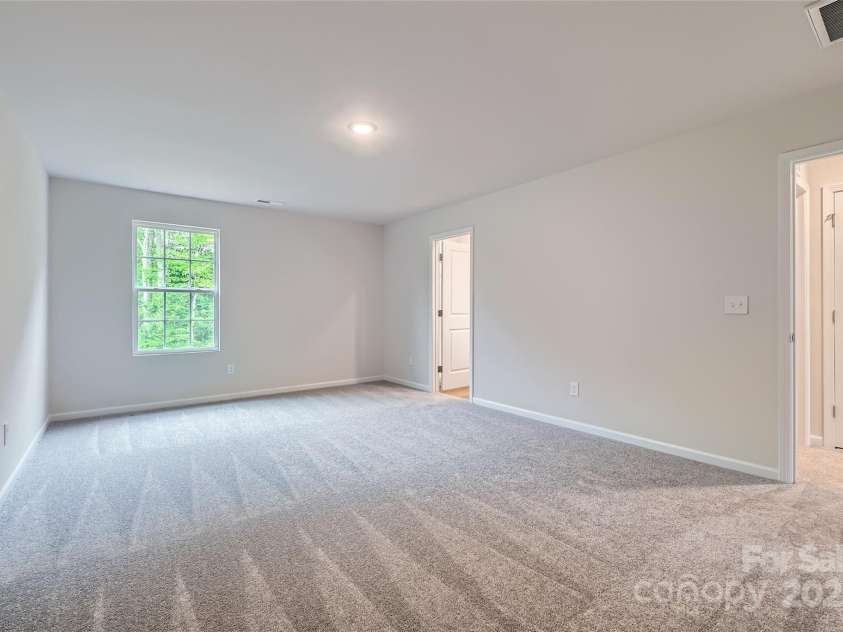 126 Dorian Place, Troutman, NC 28166.  MLS# CAR4256381, YatesRealty ID 11271. Primary Bedroom