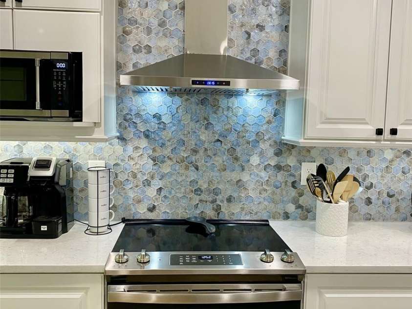 118 Lake Drive, Lake Lure, NC 28746.  MLS# CAR4254226, YatesRealty ID 11276. Electric range with custom vent hood