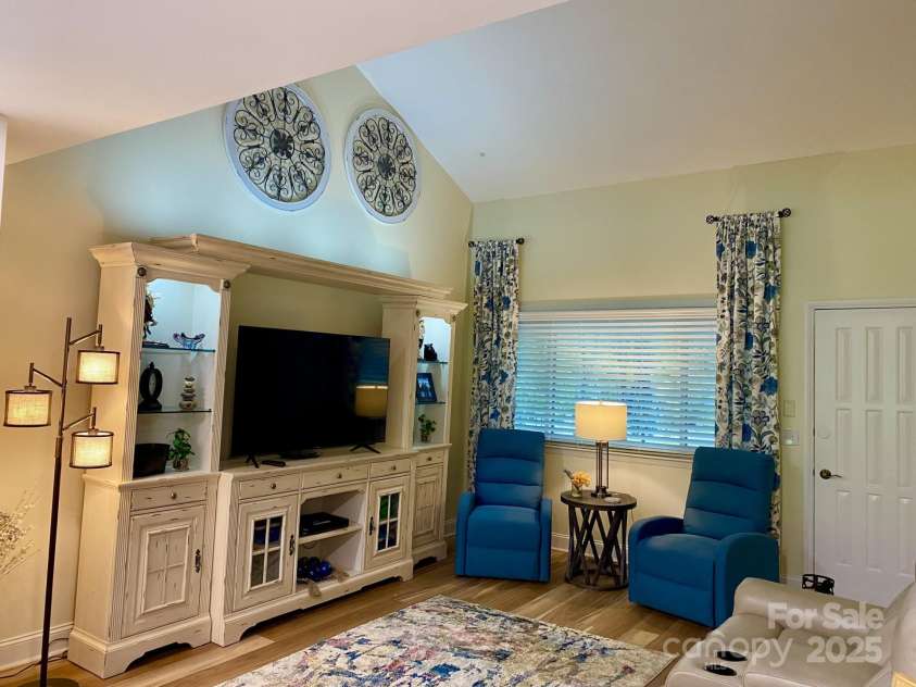 118 Lake Drive, Lake Lure, NC 28746.  MLS# CAR4254226, YatesRealty ID 11276. Elegant furnishings including this stunning entertainment center