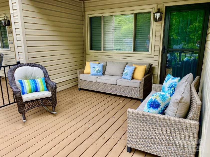 118 Lake Drive, Lake Lure, NC 28746.  MLS# CAR4254226, YatesRealty ID 11276. Huge front porch with sunset views