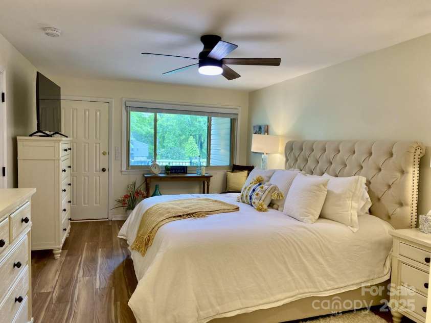 118 Lake Drive, Lake Lure, NC 28746.  MLS# CAR4254226, YatesRealty ID 11276. Large primary bedroom on first floor with mountain views