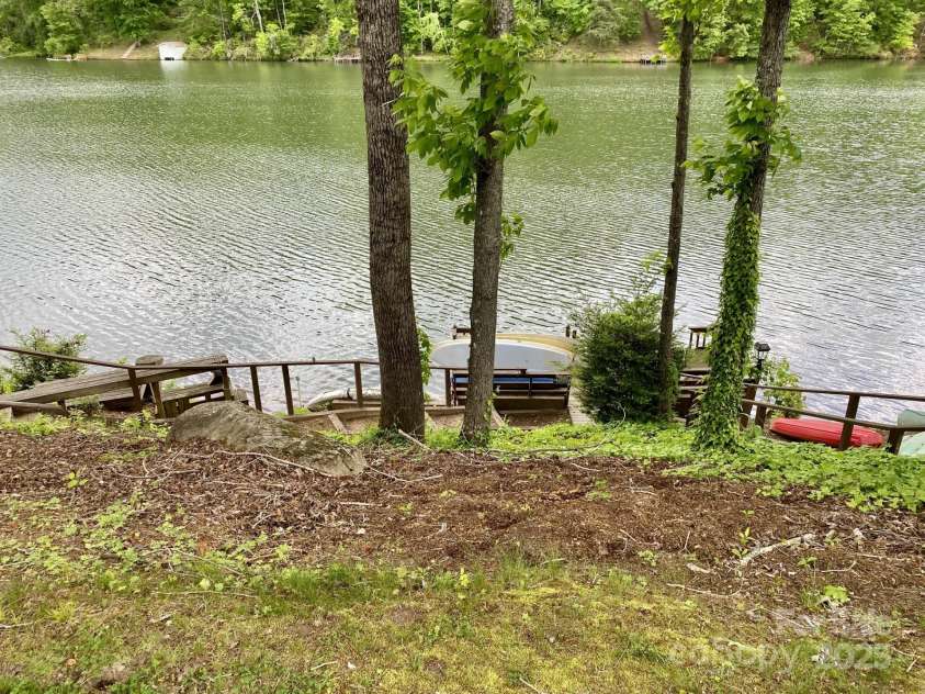 118 Lake Drive, Lake Lure, NC 28746.  MLS# CAR4254226, YatesRealty ID 11276. Shared dock space on lake for kayaks or SUP