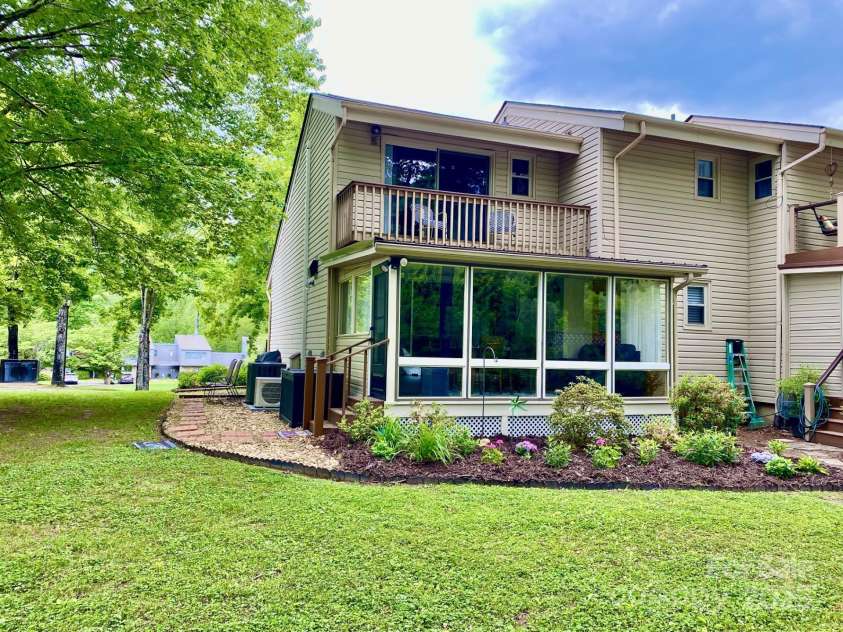 118 Lake Drive, Lake Lure, NC 28746.  MLS# CAR4254226, YatesRealty ID 11276. View from the back and more added landscaping