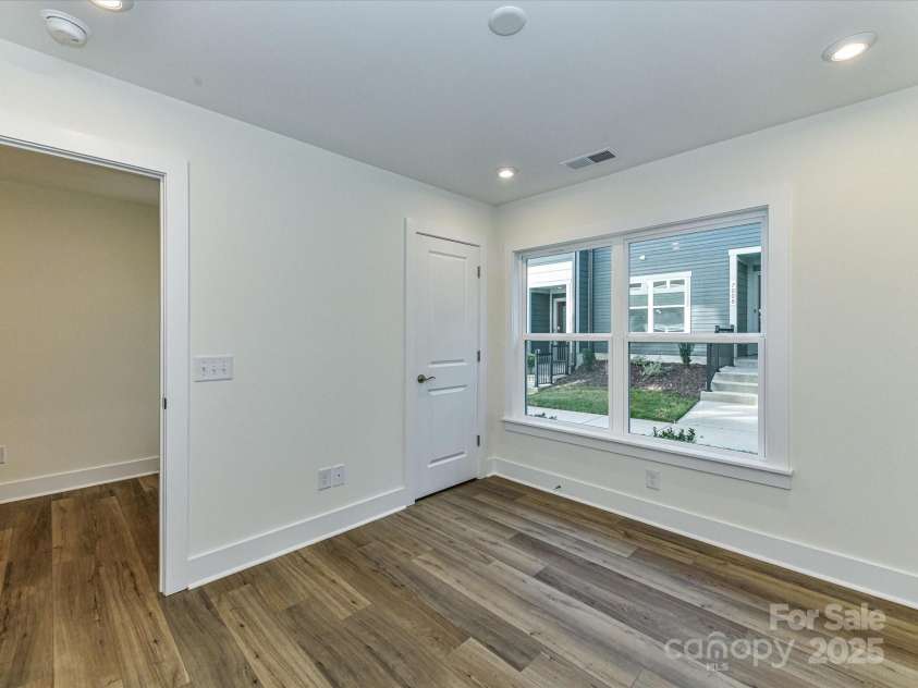 6013 Pivot Court, Charlotte, NC 28205.  MLS# CAR4256569, YatesRealty ID 11283. Closet and Large Windows at First Floor Bedroom.