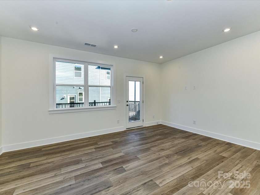 6013 Pivot Court, Charlotte, NC 28205.  MLS# CAR4256569, YatesRealty ID 11283. Great Room Leading to Outdoor Living.