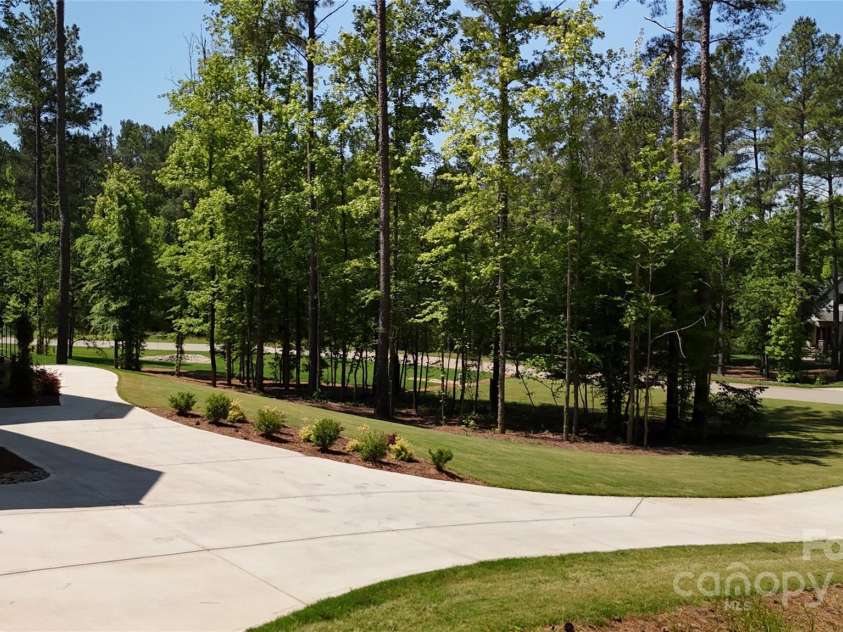 6178 Chimney Bluff Road, Lancaster, SC 29720.  MLS# CAR4172612, YatesRealty ID 11305. Drone view toward street