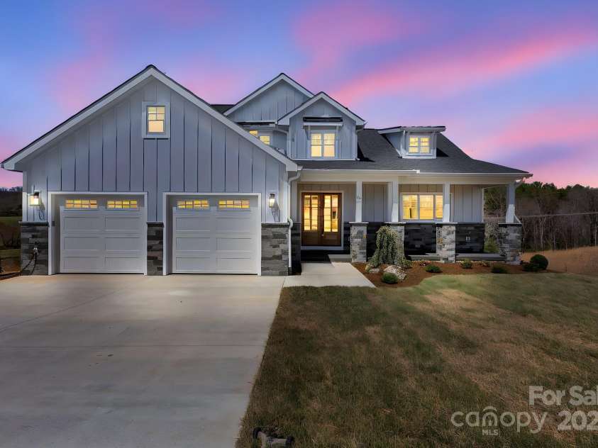 132 Golden Pasture Drive, Fletcher, NC 28732.  MLS# CAR4225018, YatesRealty ID 11306. House at twilight