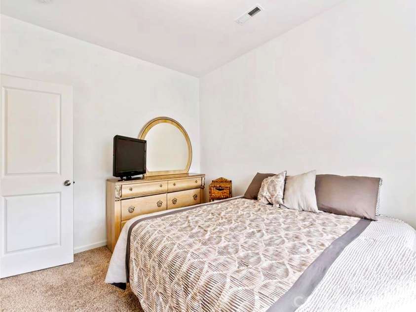 121 Asbury Place, Lexington, NC 27295.  MLS# CAR4352347, YatesRealty ID 11318. Main Level Bedroom