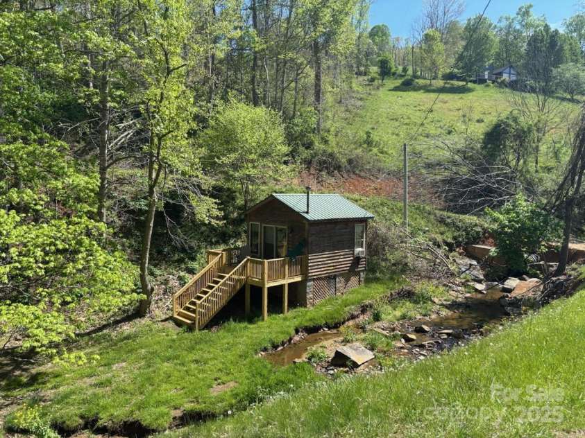 324 Marble Mine Road, Bakersville, NC 28705.  MLS# CAR4237907, YatesRealty ID 11321. Cabin across the creek