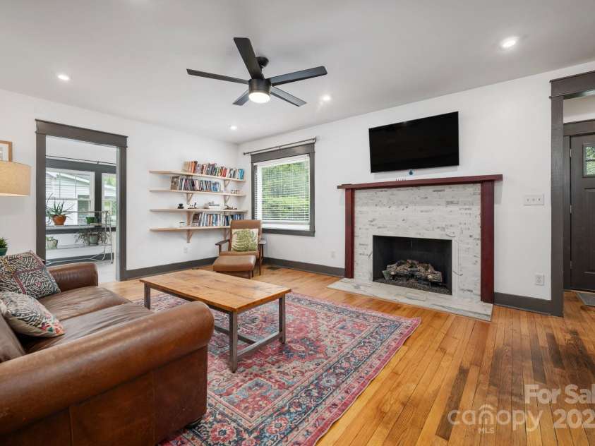81 Bear Creek Road, Asheville, NC 28806.  MLS# CAR4253442, YatesRealty ID 11325. Light-Filled Living Room w/ Gas Fireplace