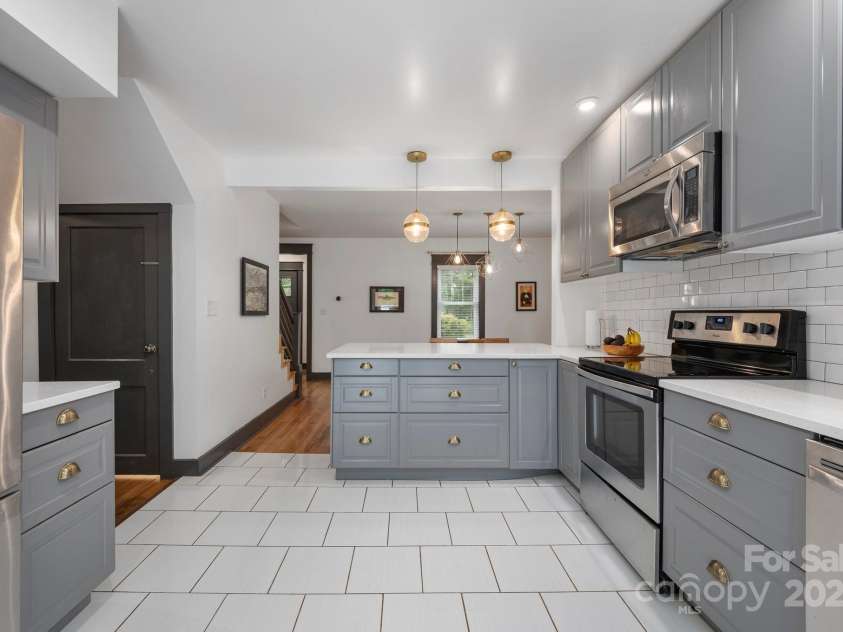 81 Bear Creek Road, Asheville, NC 28806.  MLS# CAR4253442, YatesRealty ID 11325. View to Dining Room * Door to Basement