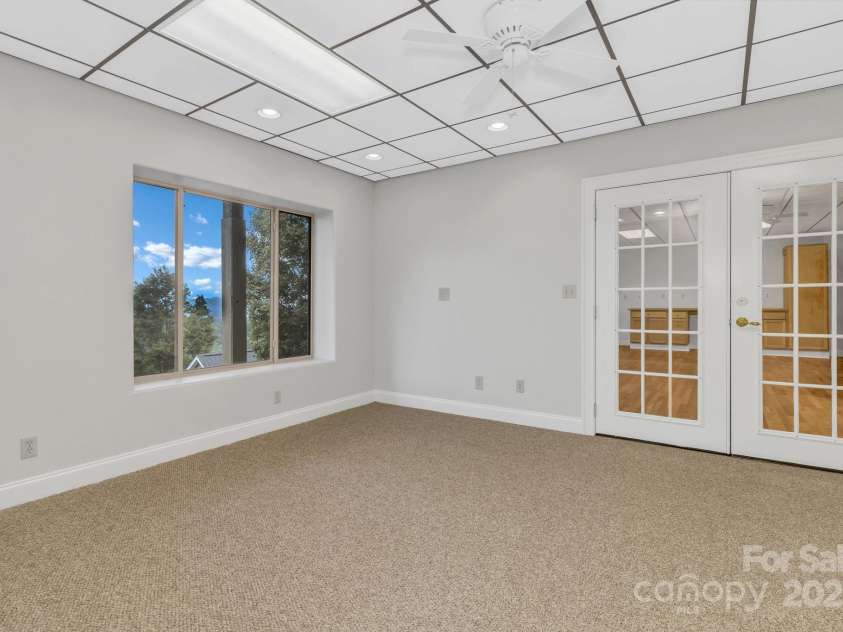 86 Distant View Drive, Asheville, NC 28803.  MLS# CAR4299899, YatesRealty ID 11339.  3rd level down. Stairs lead from the mid level 3rd bedroom. 