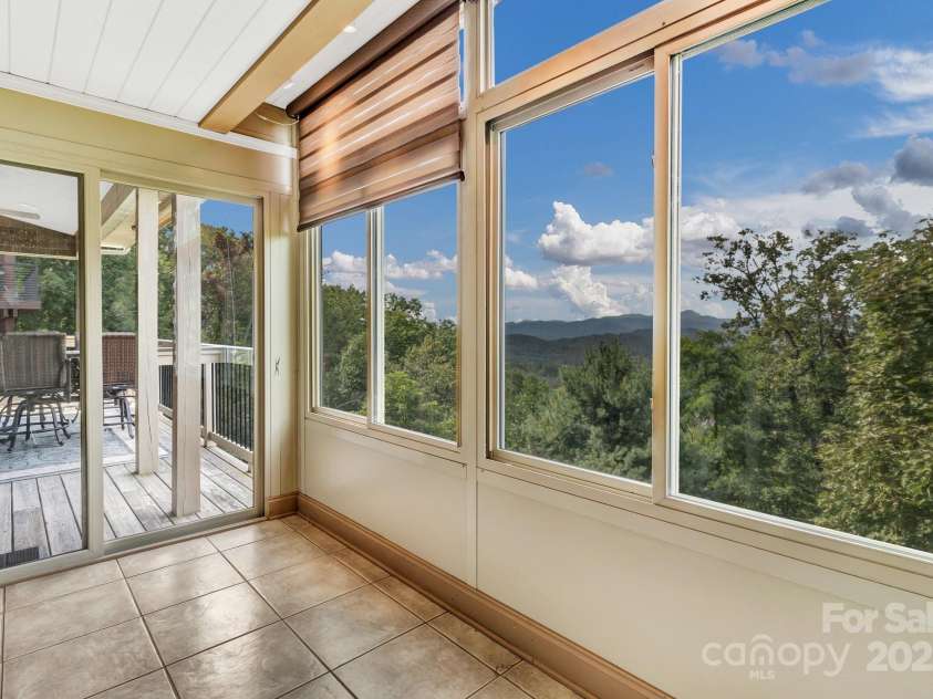 86 Distant View Drive, Asheville, NC 28803.  MLS# CAR4299899, YatesRealty ID 11339. Gracious primary bedroom just off the living room and on the main level. 