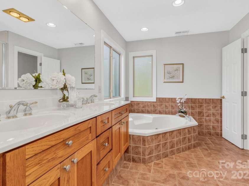 86 Distant View Drive, Asheville, NC 28803.  MLS# CAR4299899, YatesRealty ID 11339. Rear of the home showing all three levels and all three have covered outdoor space. A rare find. 