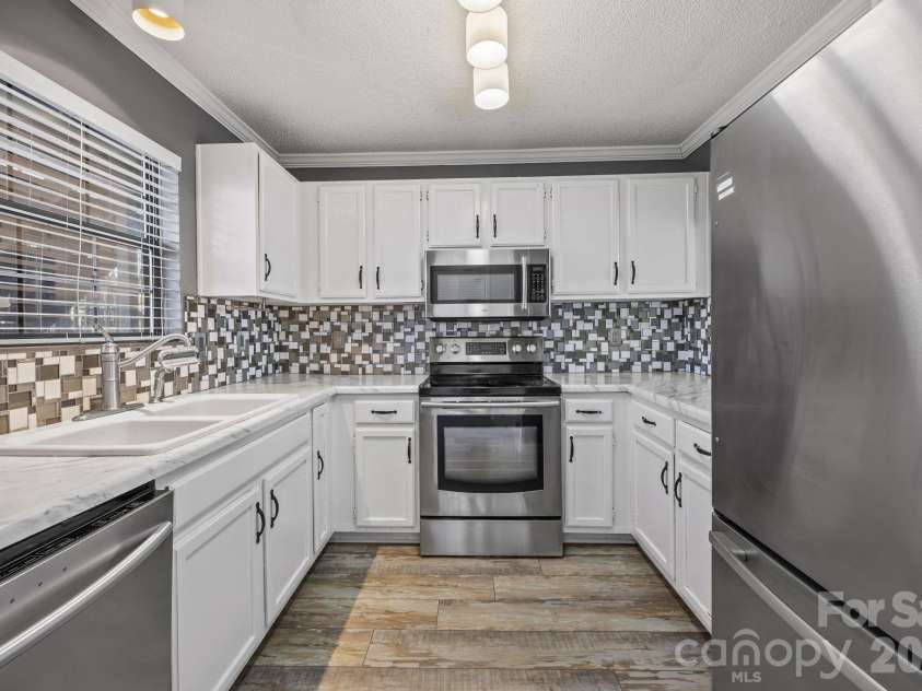 7602 Woods Lane, Cornelius, NC 28031.  MLS# CAR4345372, YatesRealty ID 11343. 
