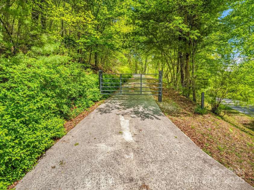 2304 Mountain Page Road, Saluda, NC 28773.  MLS# CAR4246121, YatesRealty ID 11346. Gate at beginning of driveway