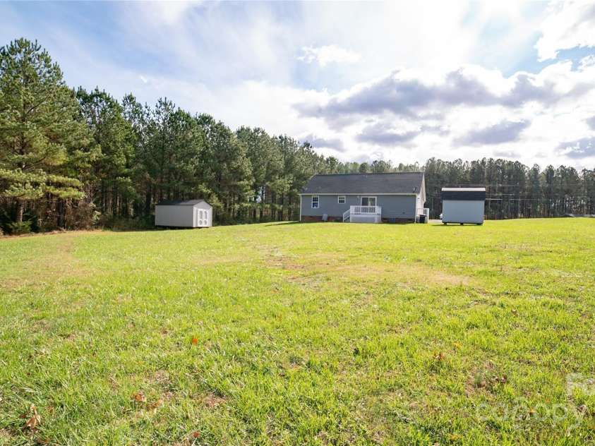 6300 Bill Sain Road, Vale, NC 28168.  MLS# CAR4252325, YatesRealty ID 11349. Rear of home from near property line