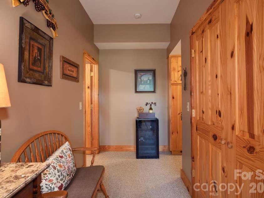 153 Brandy Ridge, Brevard, NC 28712.  MLS# CAR4366624, YatesRealty ID 11352. Lower-Level Corridor with StorageThoughtfully designed lower-level hallway featuring abundant storage and easy access to guest accommodations.