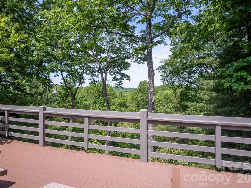 153 Brandy Ridge, Brevard, NC 28712.  MLS# CAR4366624, YatesRealty ID 11352. Private Treetop ViewsElevated deck provides a tranquil setting with beautiful forest views, fresh mountain air, and exceptional privacy.