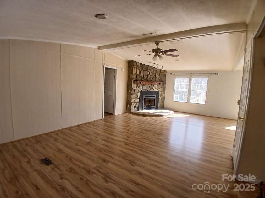 311 Coopers Gap Road, Rutherfordton, NC 28139.  MLS# CAR4213736, YatesRealty ID 11367. Great room with Stone Fireplace