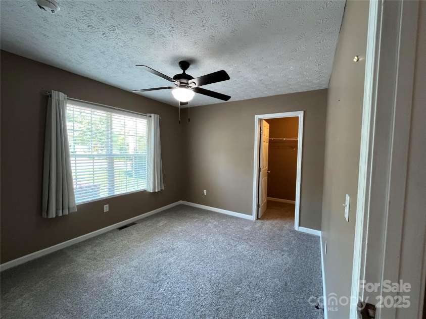 37 Woodridge View Court, Hendersonville, NC 28791.  MLS# CAR4255791, YatesRealty ID 11369. Bedroom #2 with walk in closet
