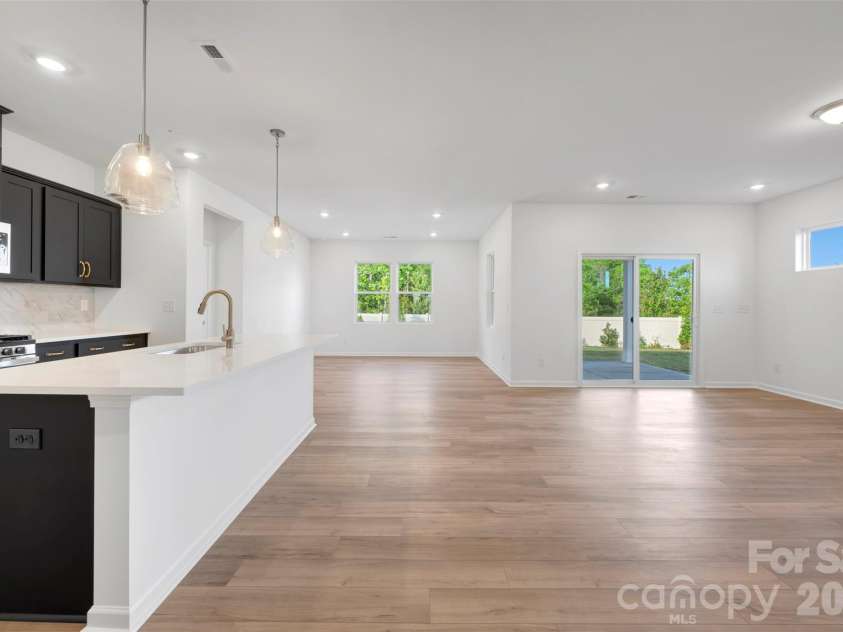408 Willoughby Park Drive, Monroe, NC 28112.  MLS# CAR4337621, YatesRealty ID 11373. Family room and breakfast area