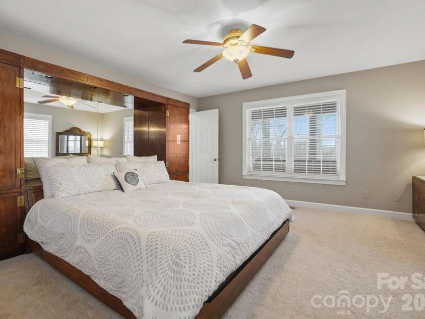 4737 Betty Davis Drive, York, SC 29745.  MLS# CAR4342456, YatesRealty ID 11374. Enjoy the convenience of a main-floor primary bedroom, thoughtfully positioned to capture incredible lake views.