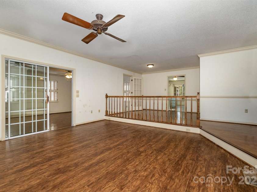 457 Birchwood Trail, Concord, NC 28025.  MLS# CAR4223374, YatesRealty ID 11376. Another view of the den looking into the sunroom