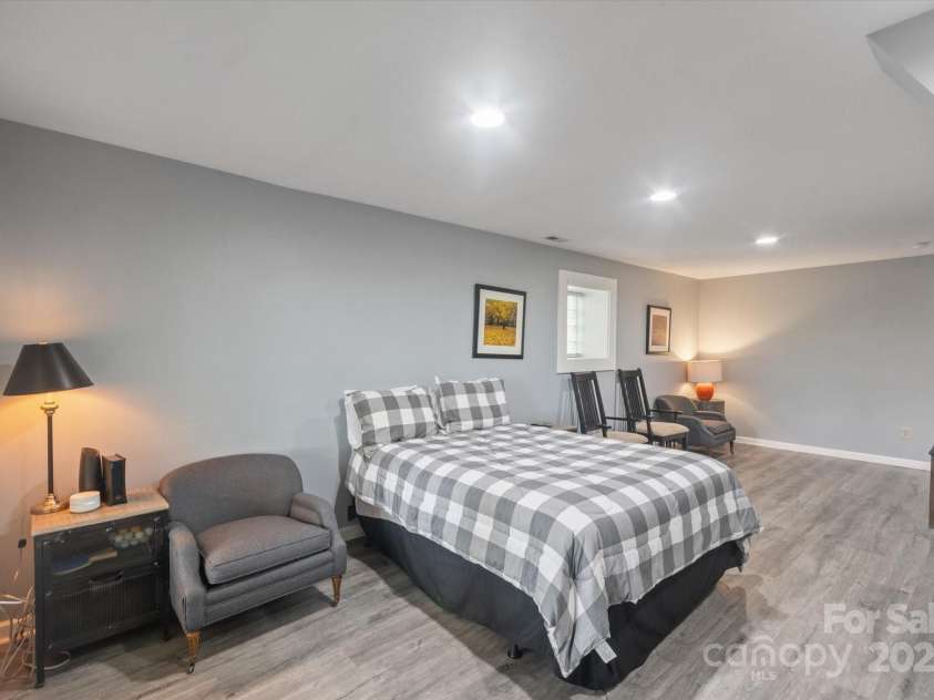94 Davey Crockett Road, Fairview, NC 28730.  MLS# CAR4310188, YatesRealty ID 11377. Basement Sleeping Room/Rec Room